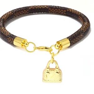 Anthropologie Gold and Brown Bracelet with Bag Charm